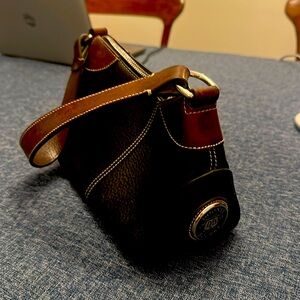 Vintage DOONEY & BOURKE pebbled black leather purse with brown leather accents
